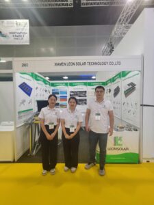 The LEON SOLAR TEAM members take a photo in front of the booth at the IGEM 2024 Exhibition.